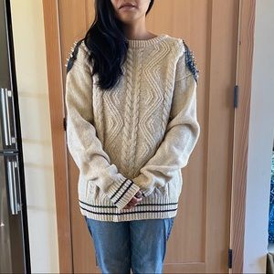 Spiked shoulder wool cable-knit sweater